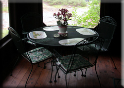 Table and chairs on screened porch